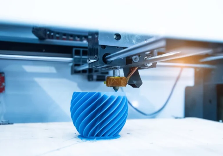 3D printer producing a blue helical object